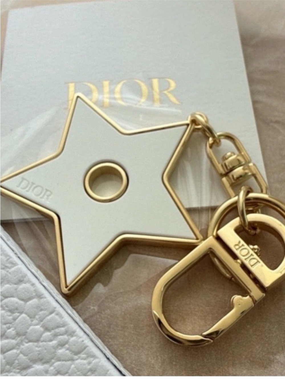 New in box - Dior White Gold Ceramic Star Keychain Bagcharm + Dior Shopping Bag